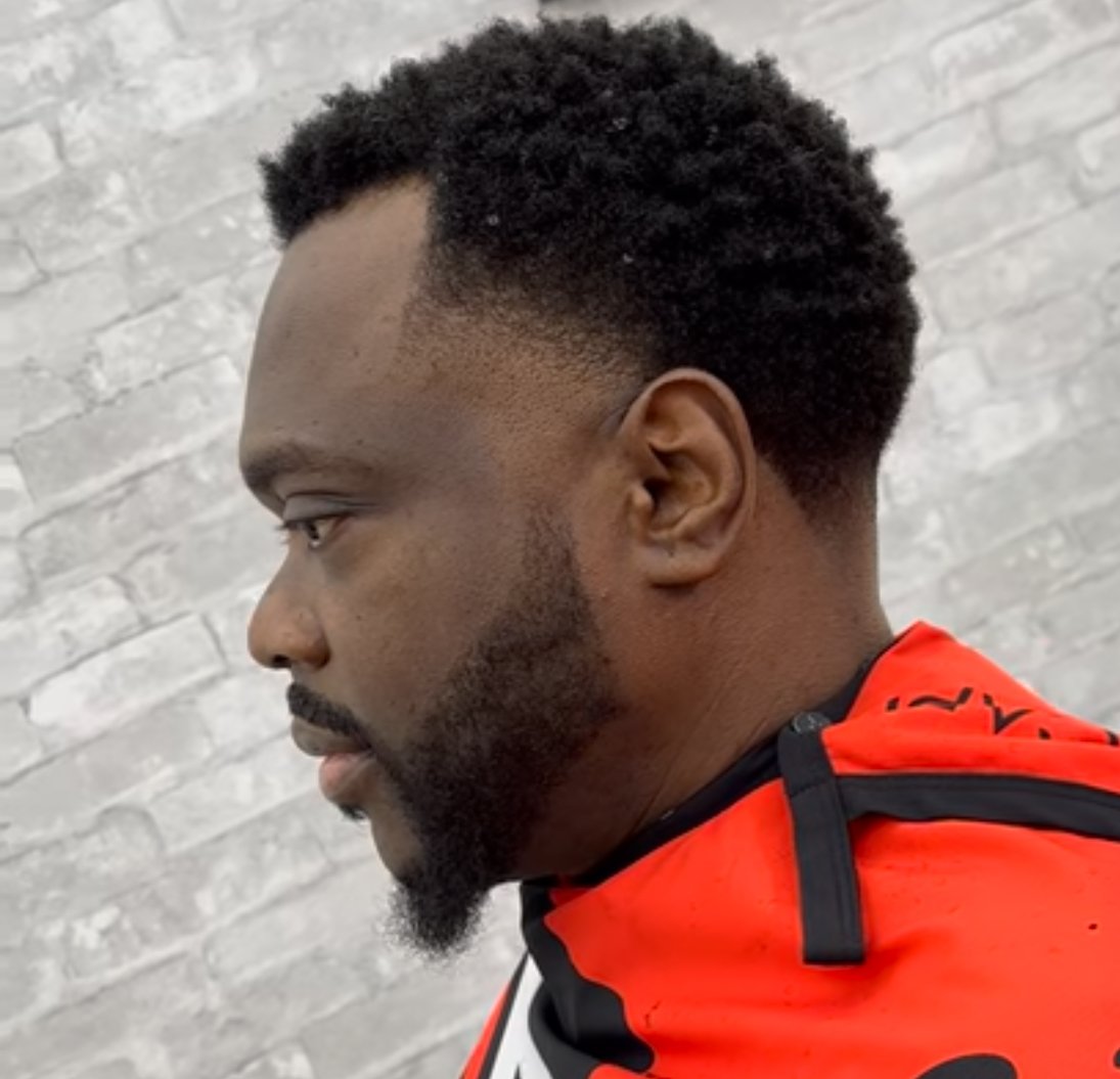 Blonde slick-back cut by PN Barbershop